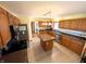 The open-concept kitchen with stainless steel appliances and a kitchen island at 3730 Cheyenne Ct, Columbus, IN 47203