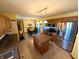Functional kitchen and dining area featuring stainless steel appliances, an island, and ample cabinet space at 3730 Cheyenne Ct, Columbus, IN 47203