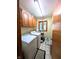 Laundry room featuring a washer, dryer, overhead cabinets, and a window for natural light at 3730 Cheyenne Ct, Columbus, IN 47203