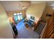 Bright living room with high ceilings, large windows, and comfortable seating area with stairway at 3730 Cheyenne Ct, Columbus, IN 47203