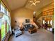 Inviting living room features a large window, a vaulted ceiling, a comfortable sofa, and a charming seating arrangement at 3730 Cheyenne Ct, Columbus, IN 47203