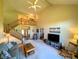 Spacious living room with vaulted ceiling, staircase, comfortable seating, and natural light creates a welcoming atmosphere at 3730 Cheyenne Ct, Columbus, IN 47203
