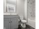 Bright bathroom featuring a bathtub, gray cabinets, and marble tile at 388 S Meridian Unit A-Bldg C St # A, Greenwood, IN 46142