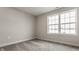 Neutral bedroom featuring plush carpet and a double-hung window letting in natural light at 388 S Meridian Unit A-Bldg C St # A, Greenwood, IN 46142