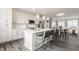 Modern kitchen with white cabinets, stainless steel appliances, and a breakfast bar with seating at 388 S Meridian Unit A-Bldg C St # A, Greenwood, IN 46142