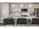 Bright, modern kitchen island with quartz countertops, bar seating, stainless steel appliances, and pendant lights at 388 S Meridian Unit A-Bldg C St # A, Greenwood, IN 46142
