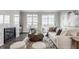 Bright living room with marble fireplace, modern furnishings, and balcony access at 388 S Meridian Unit A-Bldg C St # A, Greenwood, IN 46142
