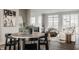 Open concept dining and living area filled with natural light, modern decor, and beautiful hardwood flooring at 388 S Meridian Unit A-Bldg C St # A, Greenwood, IN 46142