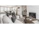 Open-concept living area with sleek decor, a modern fireplace, and a view into the gourmet kitchen at 388 S Meridian Unit A-Bldg C St # A, Greenwood, IN 46142