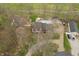 A home with a large backyard pool and playground structures from above at 3892 Arrowhead Ct, Greenfield, IN 46140