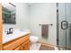 The bathroom has a vanity, toilet, shower with glass doors, tile floor, and a towel rack at 3892 Arrowhead Ct, Greenfield, IN 46140