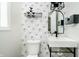 Bathroom featuring a sleek vanity, modern fixtures, and stylish wallpaper at 3892 Arrowhead Ct, Greenfield, IN 46140