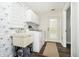 Bright laundry room with natural light and modern washer and dryer at 3892 Arrowhead Ct, Greenfield, IN 46140