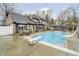 A large in-ground swimming pool and diving board enhance this home's appeal with a hot tub nearby at 3892 Arrowhead Ct, Greenfield, IN 46140