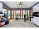 Bright sunroom with pool view, light tile floors, and plenty of natural light at 3892 Arrowhead Ct, Greenfield, IN 46140