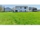 Expansive backyard with lush green grass and sunny skies at 4064 Waterfield Dr, Indianapolis, IN 46235