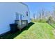 A deck and green grass in a spacious backyard with a partial view of a white house at 4064 Waterfield Dr, Indianapolis, IN 46235