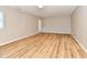 Spacious finished basement featuring an electric fireplace, vinyl plank flooring, and natural light at 4064 Waterfield Dr, Indianapolis, IN 46235