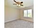Bedroom with neutral carpeting, ceiling fan, and natural light from a window at 4064 Waterfield Dr, Indianapolis, IN 46235
