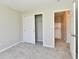Bright bedroom with carpet, closet with sliding doors and a view to the hallway at 4064 Waterfield Dr, Indianapolis, IN 46235