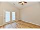 Bedroom featuring a ceiling fan and glass doors that lead to a balcony at 4064 Waterfield Dr, Indianapolis, IN 46235