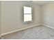 Bedroom with a window bringing in natural light and neutral carpet at 4064 Waterfield Dr, Indianapolis, IN 46235