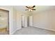 Bedroom featuring carpet, ceiling fan, ensuite bathroom, and closet at 4064 Waterfield Dr, Indianapolis, IN 46235