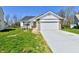 Charming single-story home with a two-car garage and a well-manicured front lawn at 4064 Waterfield Dr, Indianapolis, IN 46235