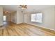 Open living space with wood flooring, neutral walls, and a ceiling fan at 4064 Waterfield Dr, Indianapolis, IN 46235