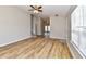 Well lit room with wood-look floors, stairs, a window, and recessed lighting at 4064 Waterfield Dr, Indianapolis, IN 46235