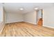 Spacious room featuring wood-look floors, recessed lighting, and stairs to another level at 4064 Waterfield Dr, Indianapolis, IN 46235