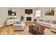Cozy living room showcases a fireplace, a neutral color scheme, and modern furniture on hardwood floors at 4064 Waterfield Dr, Indianapolis, IN 46235
