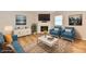 Comfortable living room features a fireplace, modern furnishings, and a decorative rug on hardwood floors at 4064 Waterfield Dr, Indianapolis, IN 46235
