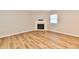 Well lit living room featuring wood-look floors and a fireplace at 4064 Waterfield Dr, Indianapolis, IN 46235