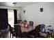 Well-lit dining room with a formal dining table, chairs, and simple decorations at 4107 Eisenhower Dr, Indianapolis, IN 46254