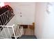 View down the stairs to a door with railings on both sides of the stairway at 4107 Eisenhower Dr, Indianapolis, IN 46254