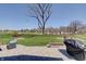Well-manicured backyard featuring a paver patio, seating area, and lush lawn at 4140 Omaha Dr, Bargersville, IN 46106