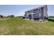Beautiful backyard with spacious patio seating and landscaped lawn, perfect for outdoor entertaining at 4140 Omaha Dr, Bargersville, IN 46106
