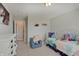 Bedroom features a white metal bed, a white dresser, and a blue chair at 4140 Omaha Dr, Bargersville, IN 46106