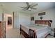Bedroom features a closet, ceiling fan, neutral walls, carpeted floors, and a wood bedroom suite at 4140 Omaha Dr, Bargersville, IN 46106
