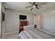 Bedroom with closet, ceiling fan, neutral walls, carpeted floors, and a wood bedroom suite at 4140 Omaha Dr, Bargersville, IN 46106