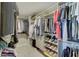 Well-organized walk-in closet with shelving, drawers, and ample storage space for clothing and shoes at 4140 Omaha Dr, Bargersville, IN 46106