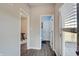 Hallway with views into a bathroom, office, and the home's rear patio at 4140 Omaha Dr, Bargersville, IN 46106