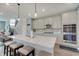 Spacious kitchen featuring a large island with seating, stainless appliances, and sleek gray cabinets at 4140 Omaha Dr, Bargersville, IN 46106