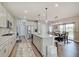 Open-concept kitchen and dining area with a spacious island, modern appliances, and stylish finishes at 4140 Omaha Dr, Bargersville, IN 46106