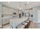 Modern kitchen boasts a large island with barstool seating, stainless appliances, and an open layout at 4140 Omaha Dr, Bargersville, IN 46106