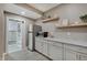 Kitchenette featuring granite countertops, white cabinets, stainless steel appliances, and wood-look flooring at 4140 Omaha Dr, Bargersville, IN 46106