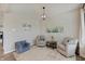 Comfortable living room with neutral swivel chairs, stylish decor, soft rug, and serene wall art at 4140 Omaha Dr, Bargersville, IN 46106