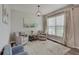 Cozy living room with two swivel chairs, a modern chandelier, neutral rug, and a serene wall art piece at 4140 Omaha Dr, Bargersville, IN 46106