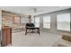 Bright office space with modern wood accent wall, neutral carpet and a ceiling fan for added comfort at 4140 Omaha Dr, Bargersville, IN 46106